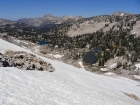 Climbing a snowfield to the pass above Ten Lake Basin.