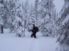 John took this shot of me after leaving the summit. There are some snowshoes under that snow somewhere.