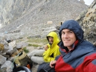 Chris and Dave waiting out the storm at the lower saddle. The Exum guide huts are in the background.