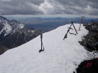 Our ice axes taking a break on the summit, notice the low cloud ceiling in the background.