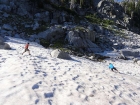 Playing on a big snowfield near the lake.