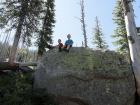 Taking a break on a big granite boulder.
