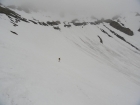 Chris skiing below the east face of Kent Peak.