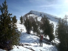 Steve taking a break. John and Mariel are nearing the crux on Pole Creek Peak #3.