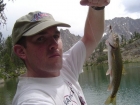 Me and the big rainbow I caught in Scree Lake, just before the rainstorm.