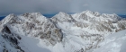 Summit view including Peak 11967', Mount Idaho, and Mount Borah.